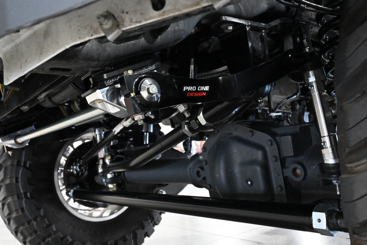 Installed Pro One Design suspension and differential viewed from under a truck